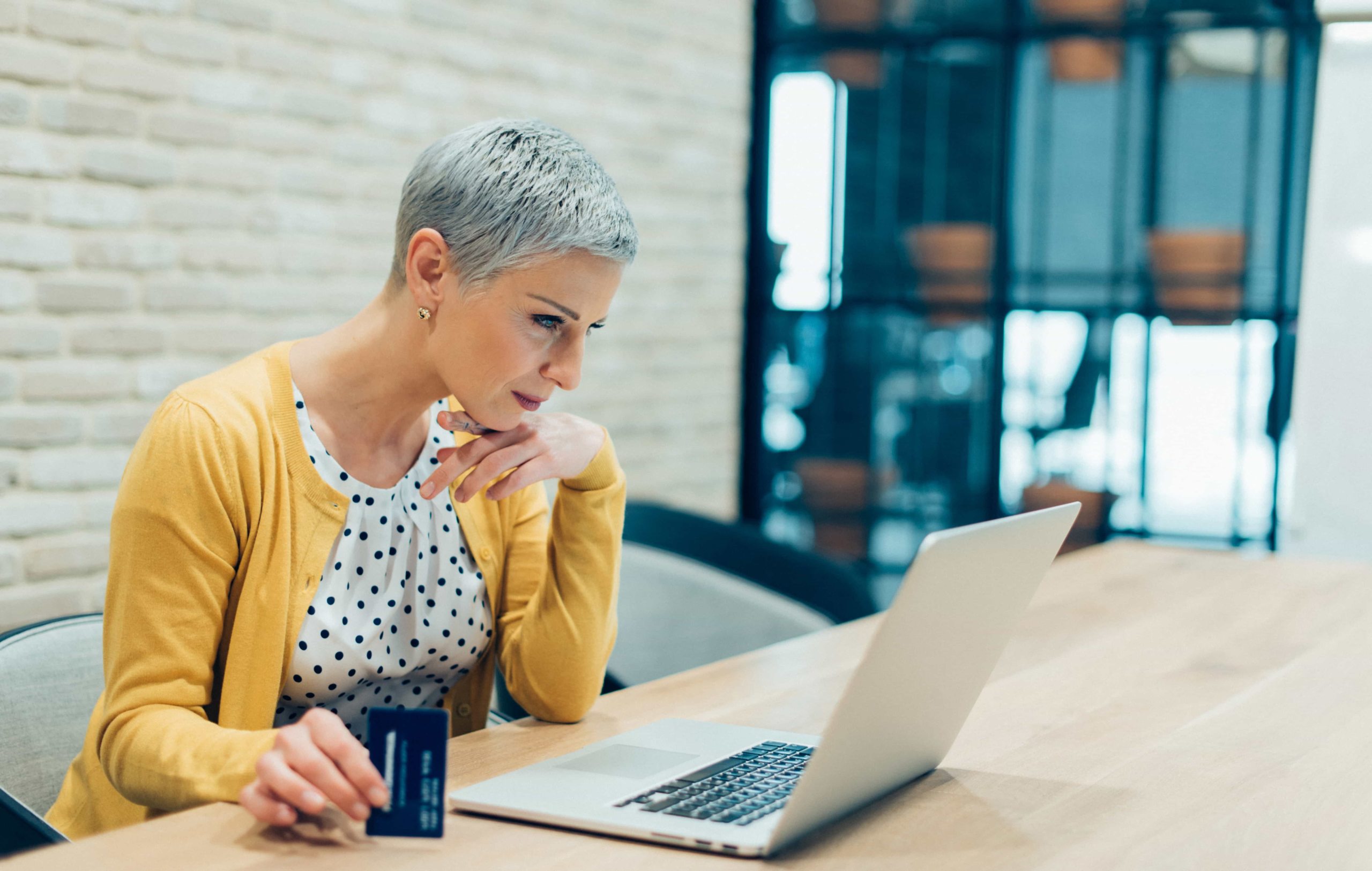 woman looking over credit card statements