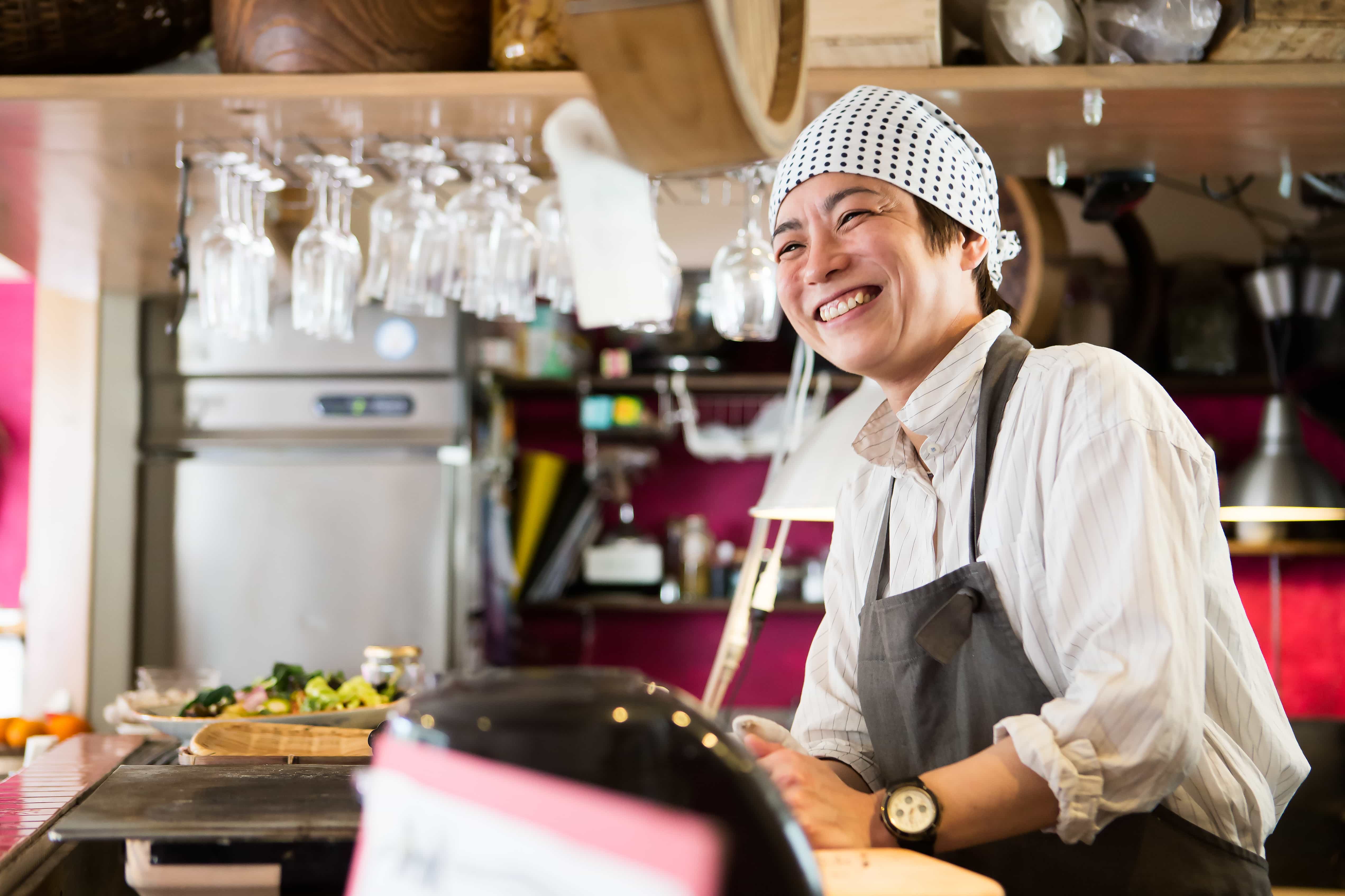 person smiling after using one of the best business credit cards