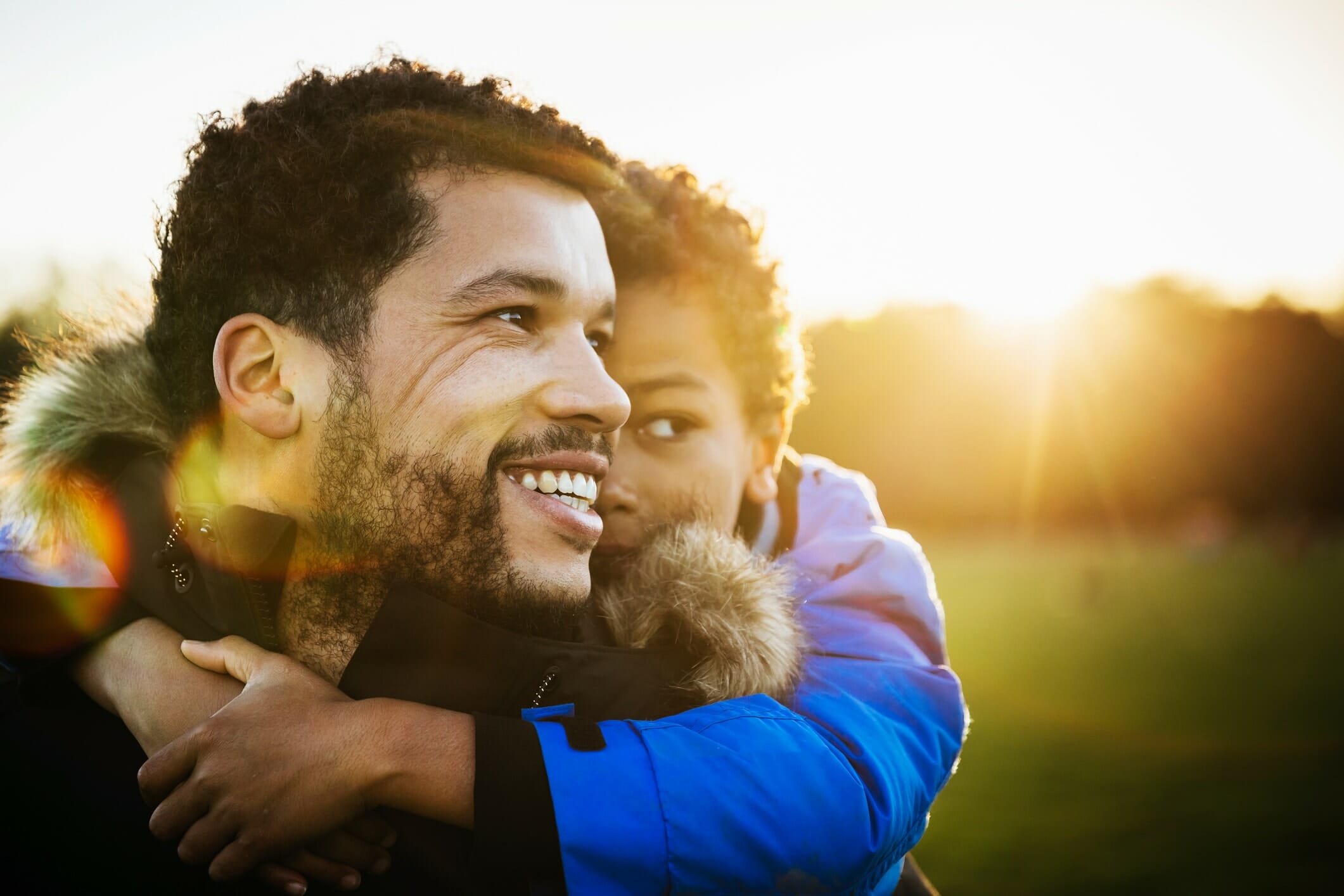 Man and child happy with their credit score