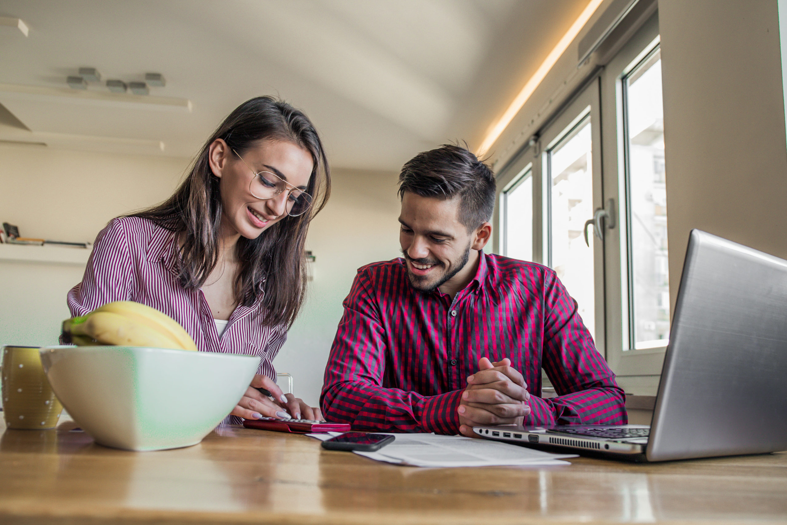 Couple having conversation about money, bills, and finances