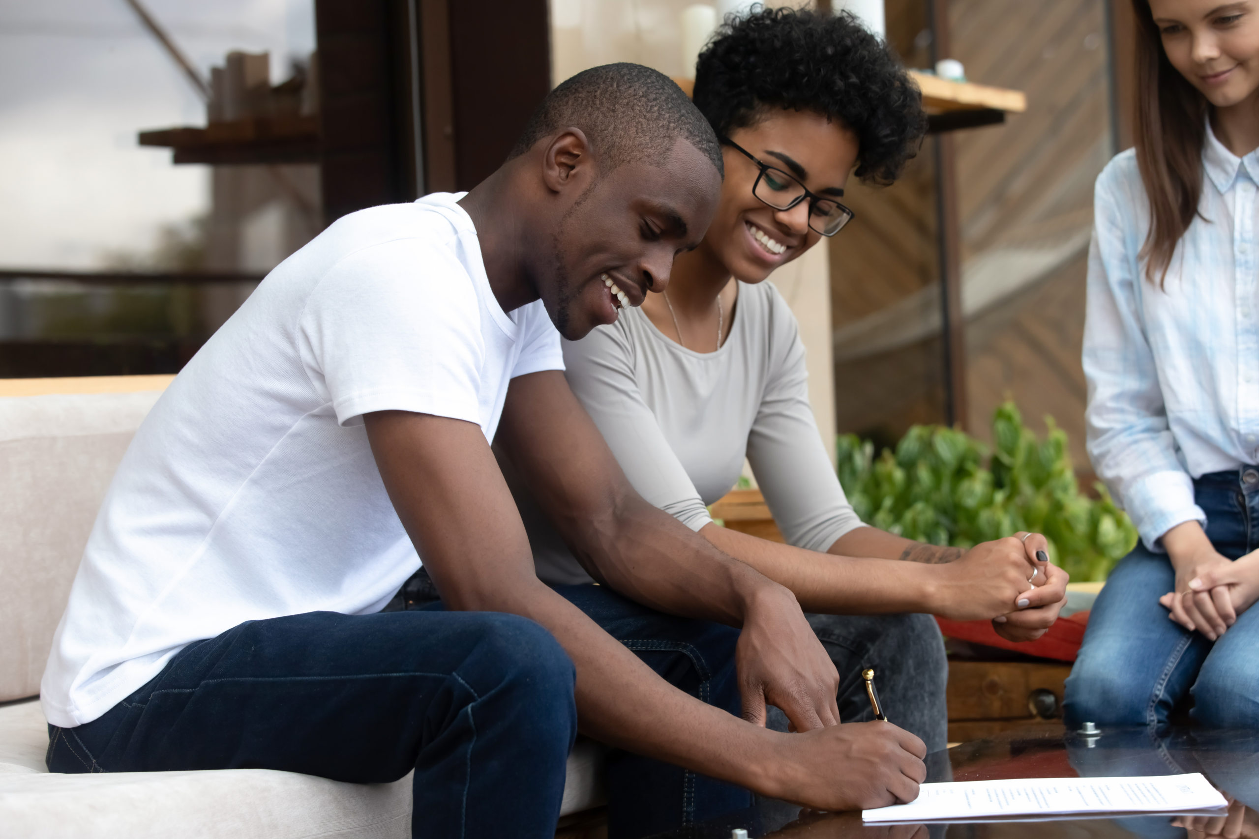 Couple planning their wedding and opening a wedding savings account