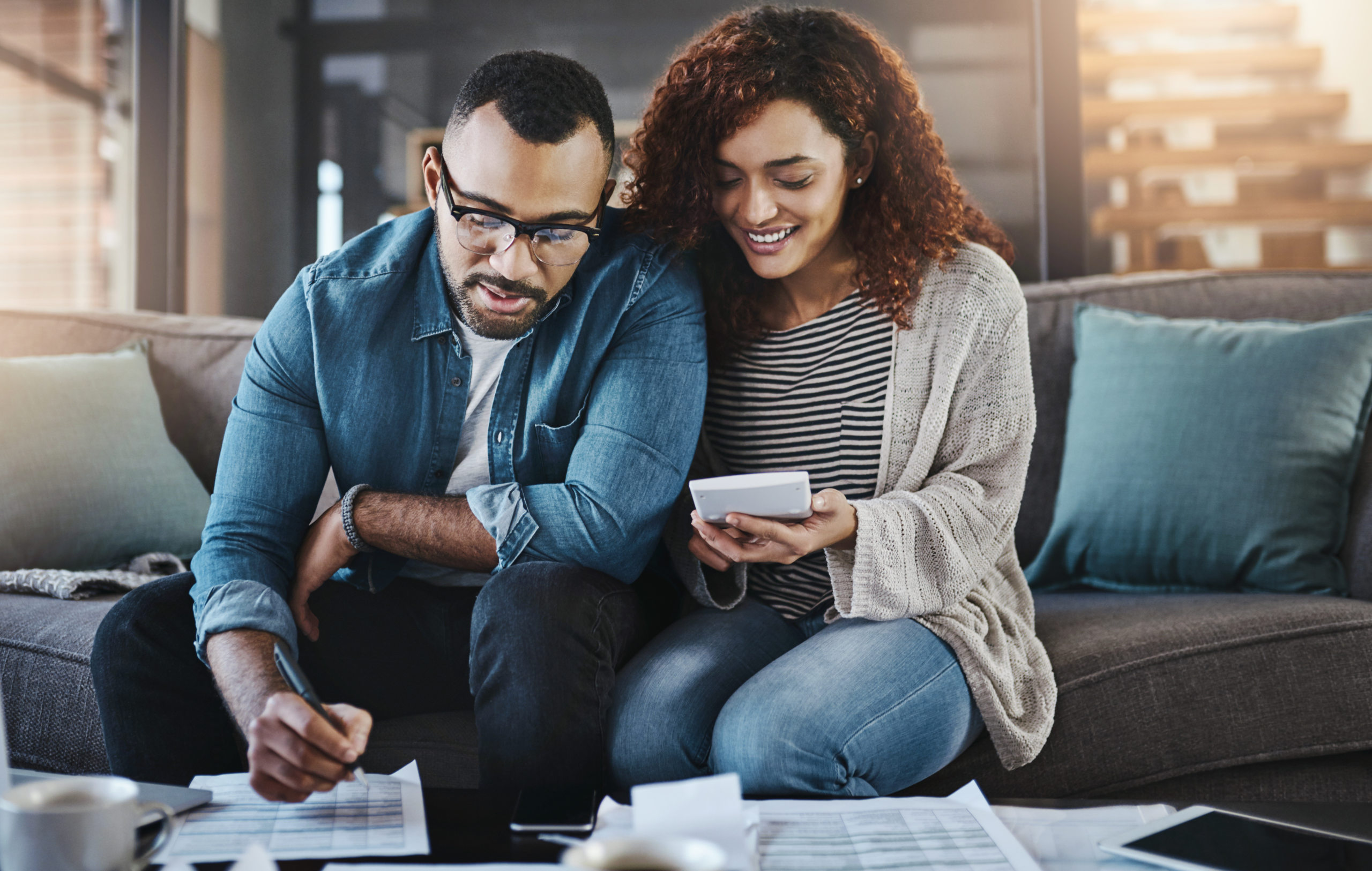 Shot of a young couple planning how they will save for a down payment for a house