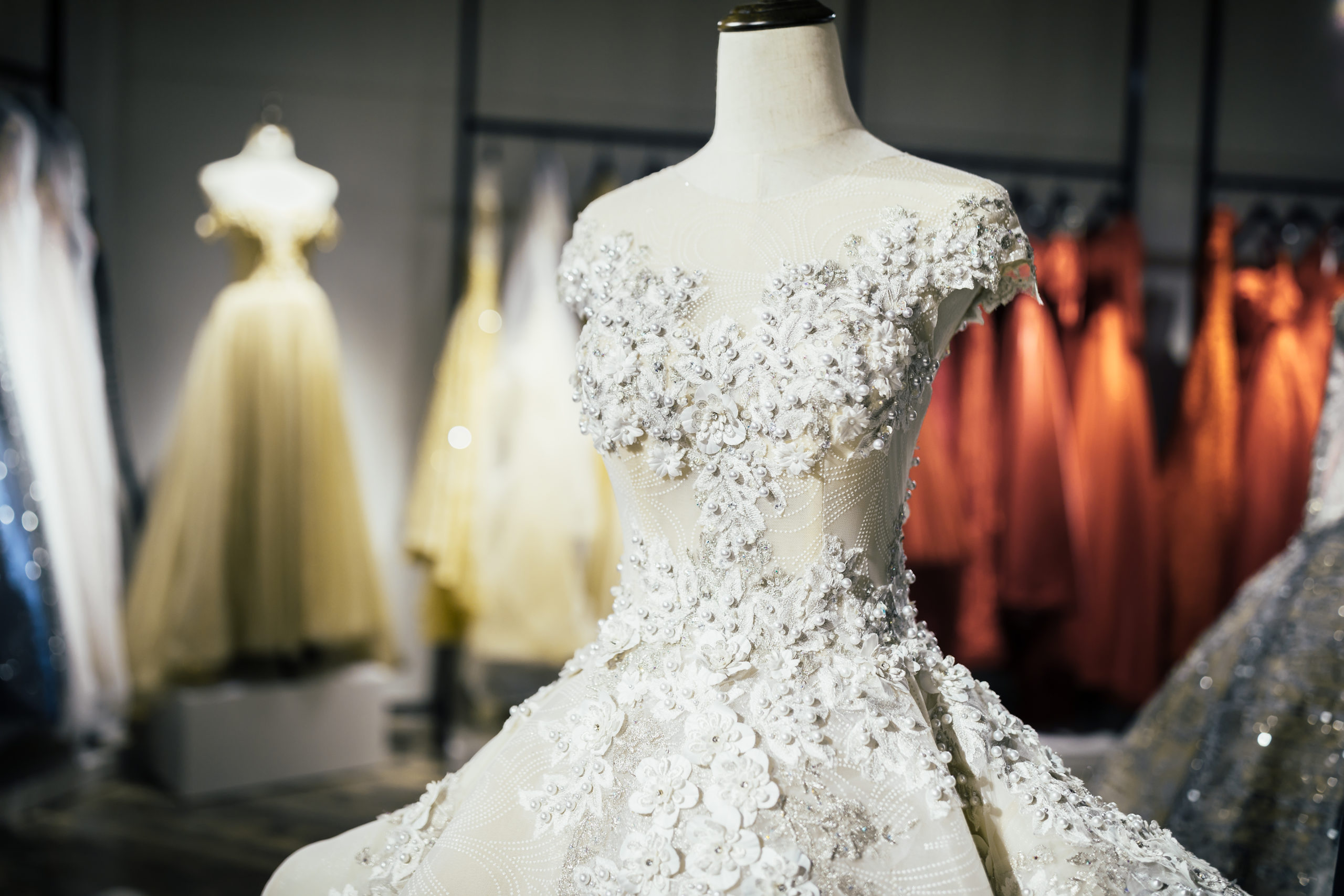 Elegant lace dress on mannequin in wedding dress shop