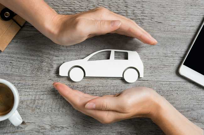 hands holding a car figure