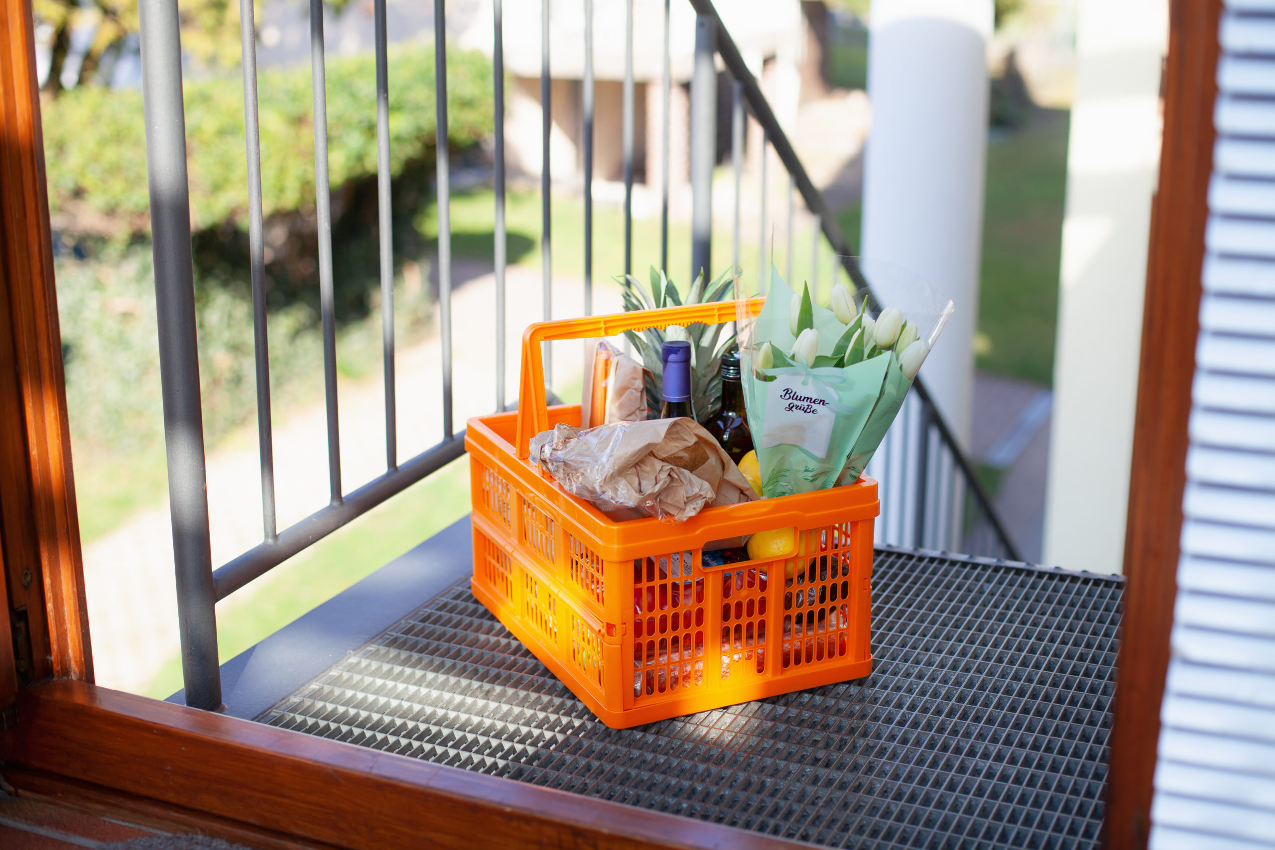 Neighborly help: A basket full of groceries left at the door