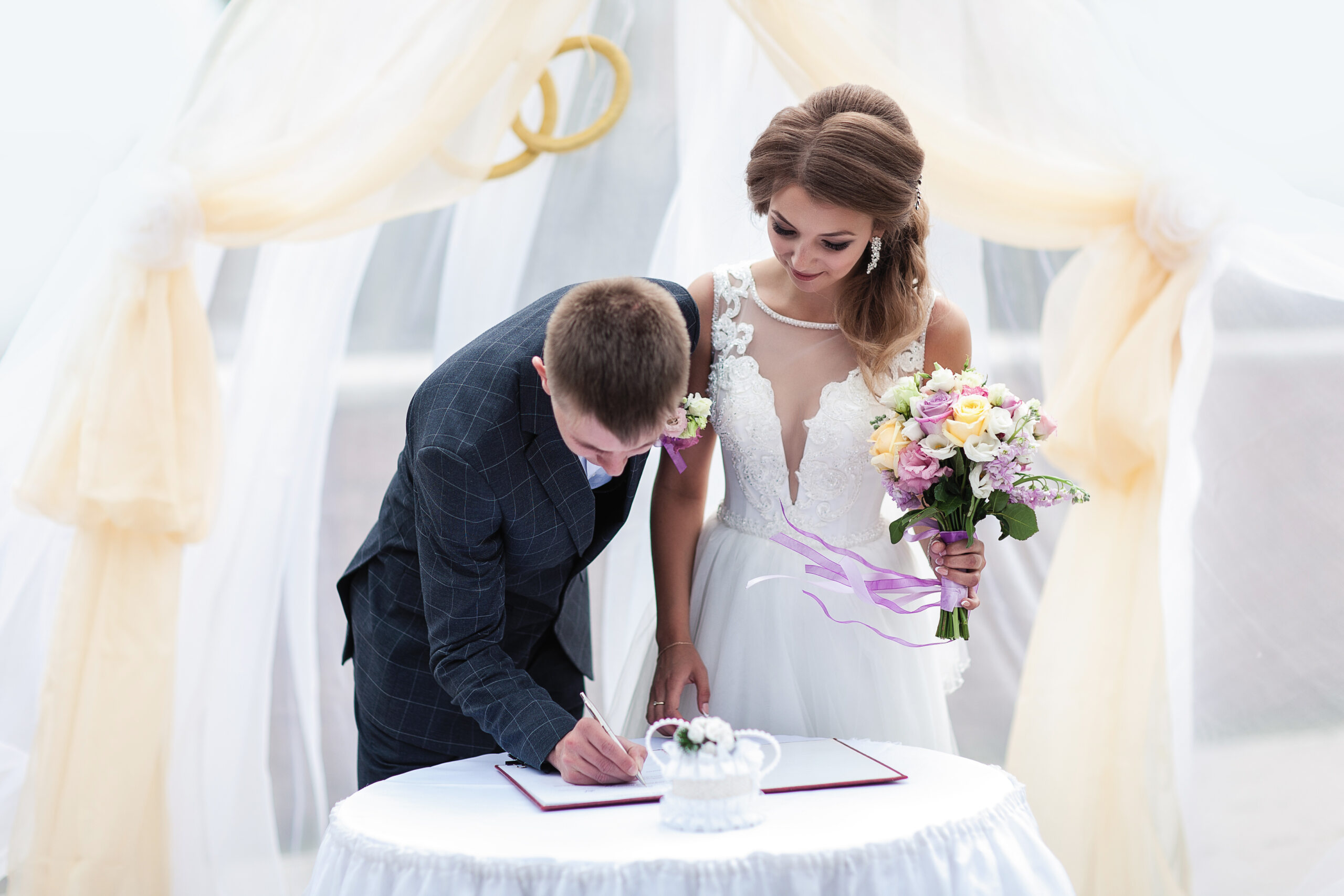 couple signing marriage license