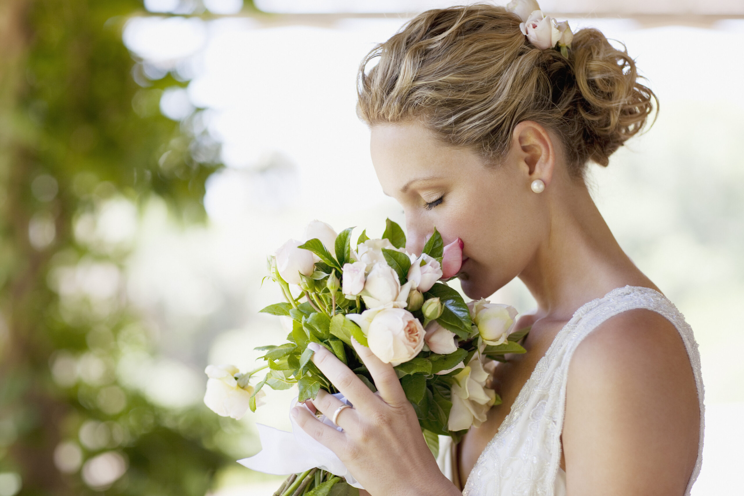a bride holding wedding flowers