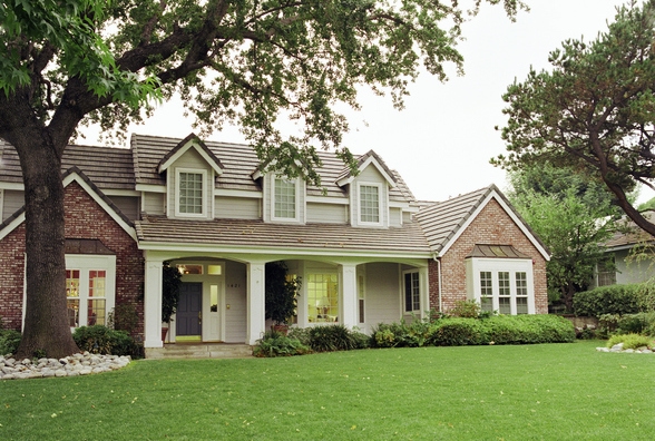 Front of a home with lawn.